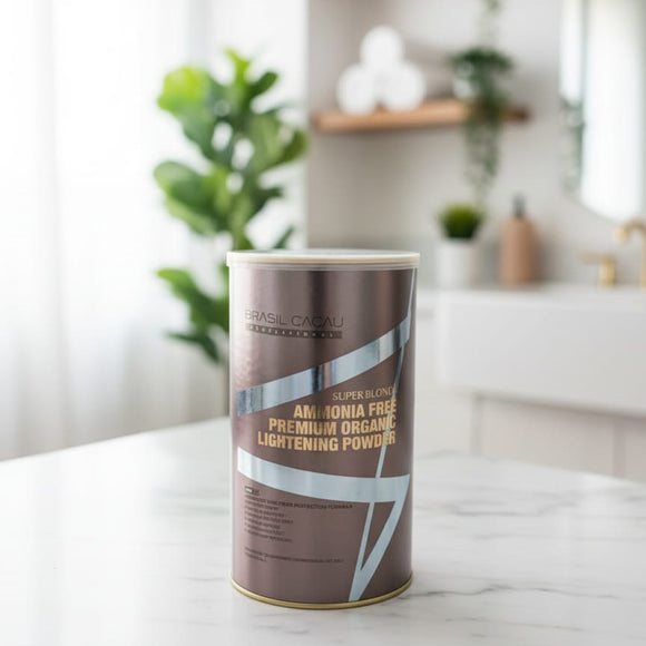 Brasil Cacau Lightening Powder (Bleaching Powder) in a white and green tub with a green label. The text clearly shows the brand BRASIL CACAU PROFESSIONAL and highlights the product as NON IRRITATING BLEACHING POWDER with a 9 LEVEL LIFT. The product weight is 500g. Barcode: 7898606741433