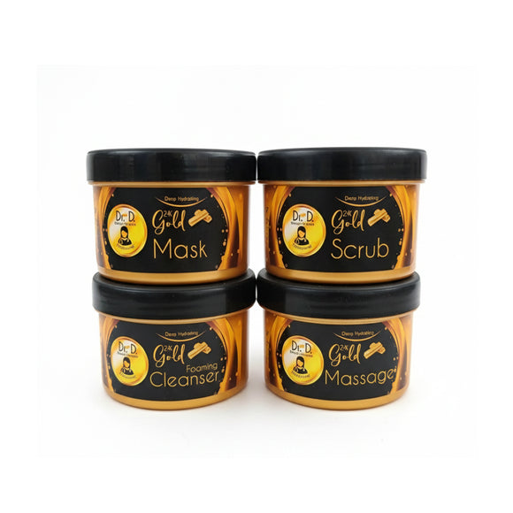 Dr. Derma Gold Facial Core 4-Piece Kit. Four 120ml black and gold jars containing the essential facial creams: Gold Scrub, Gold Massage, Gold Cleanser, and Gold Mask, presented in a clean, professional alignment