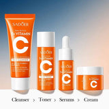 SADOER VC Whitening Brightening 4-Piece Skincare Travel Set unboxed as shown in 'Sadoer Vitamin C Travel Kit open.jpg'. The vibrant orange travel tubes and bottles include the 5X Vitamin face cleanser, essence toner, glow face serum, and brightening face cream for an even complexion, available at Harram Store. Barcode: 6942349749445